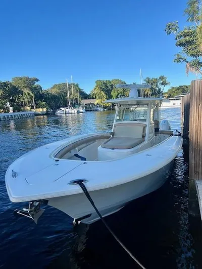 Mambo #5 Yacht Photos Pics 2017 Scout LXF 350 boat docked on a sunny day by the water.