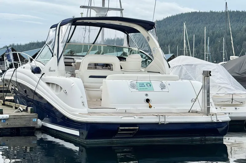  Yacht Photos Pics 2004 Sea Ray 420 Sundancer yacht docked, available for sale, in a marina setting.