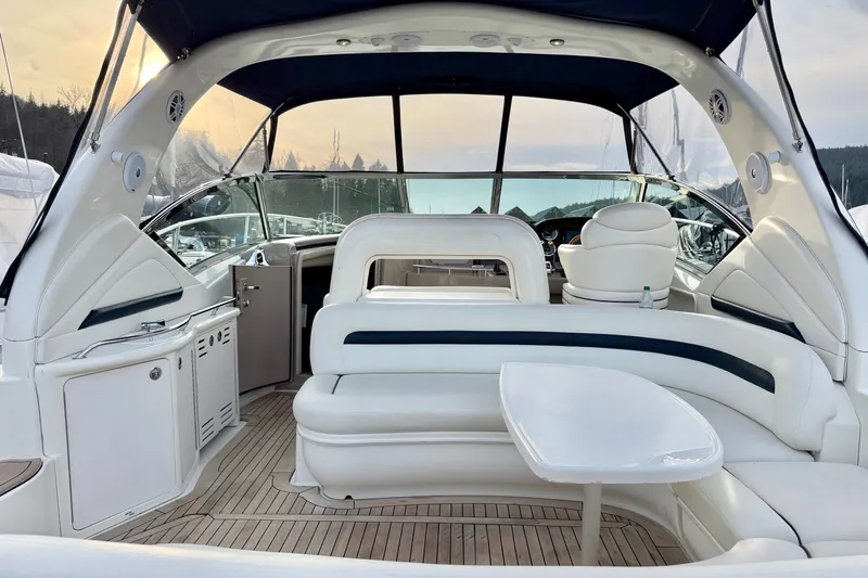  Yacht Photos Pics 2004 Sea Ray 420 Sundancer yacht interior with white seating and wooden flooring.