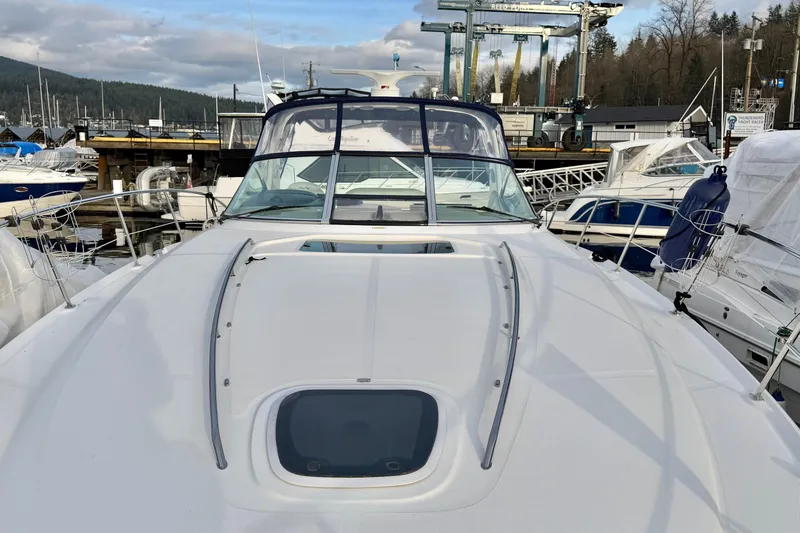  Yacht Photos Pics 2004 Sea Ray 420 Sundancer yacht docked at marina, showcasing sleek design and spacious deck.