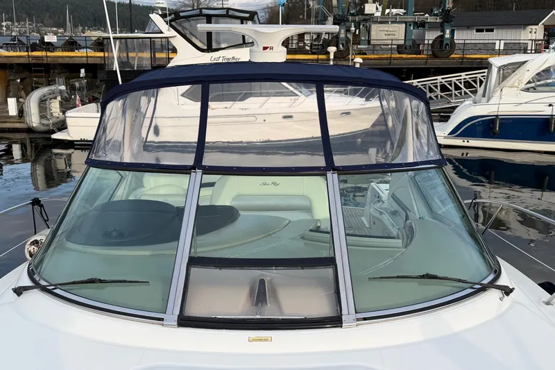  Yacht Photos Pics 2004 Sea Ray 420 Sundancer yacht docked at marina, featuring sleek design and spacious cockpit.