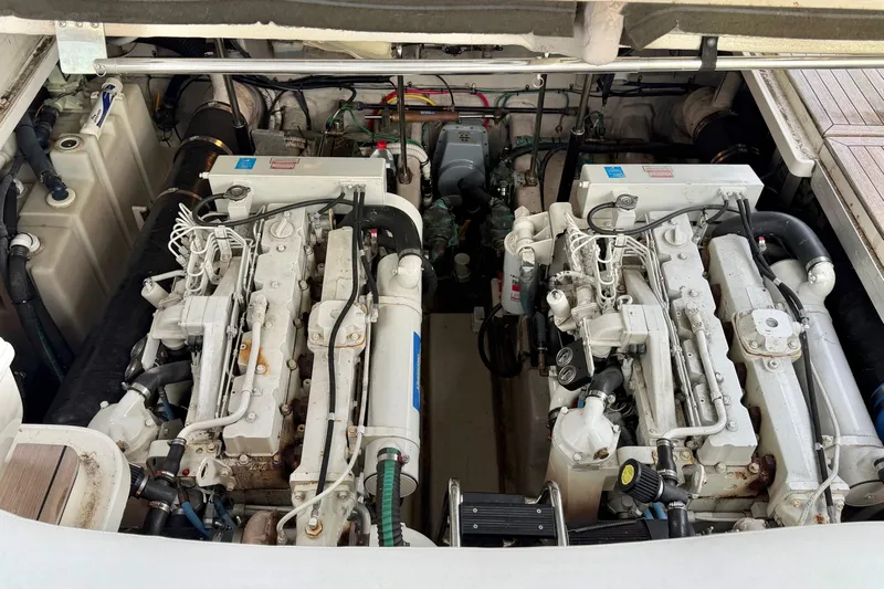  Yacht Photos Pics Engine compartment of a 2004 Sea Ray 420 Sundancer boat, showcasing dual engines.