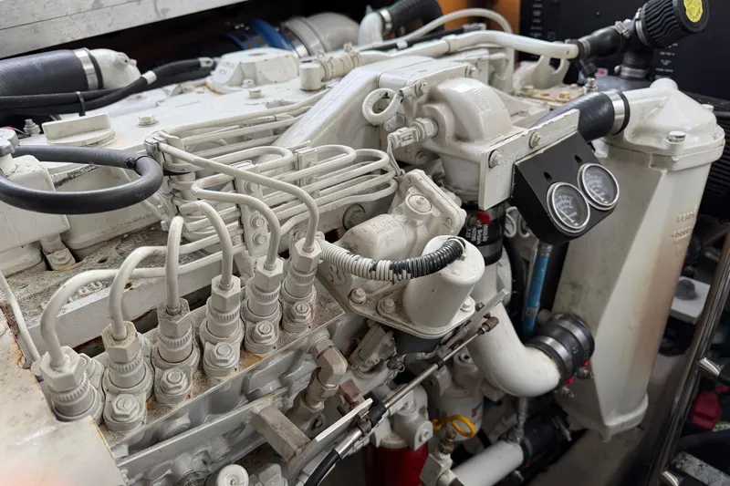  Yacht Photos Pics Engine compartment of a 2004 Sea Ray 420 Sundancer boat, showcasing detailed mechanical components.