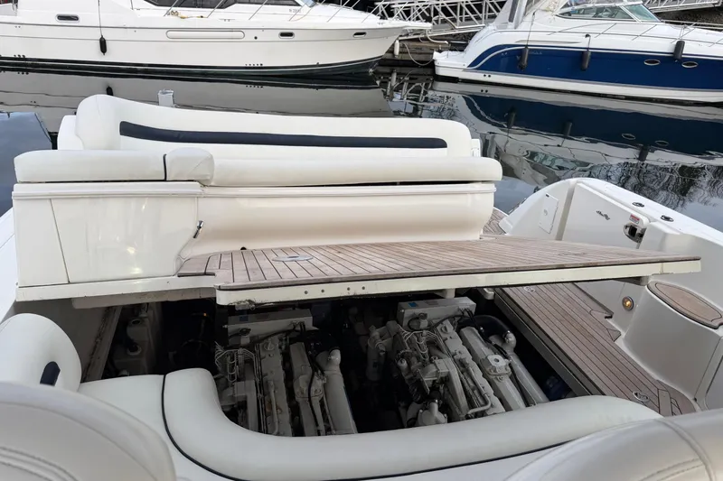  Yacht Photos Pics 2004 Sea Ray 420 Sundancer yacht with open engine compartment at marina.