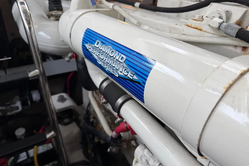  Yacht Photos Pics Engine detail of 2004 Sea Ray 420 Sundancer with Diamond Performance Series label.