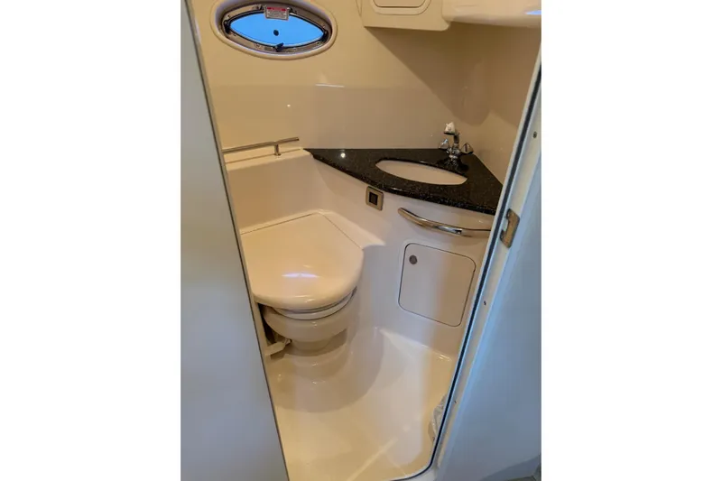  Yacht Photos Pics Compact bathroom in 2004 Sea Ray 420 Sundancer yacht with toilet and sink.