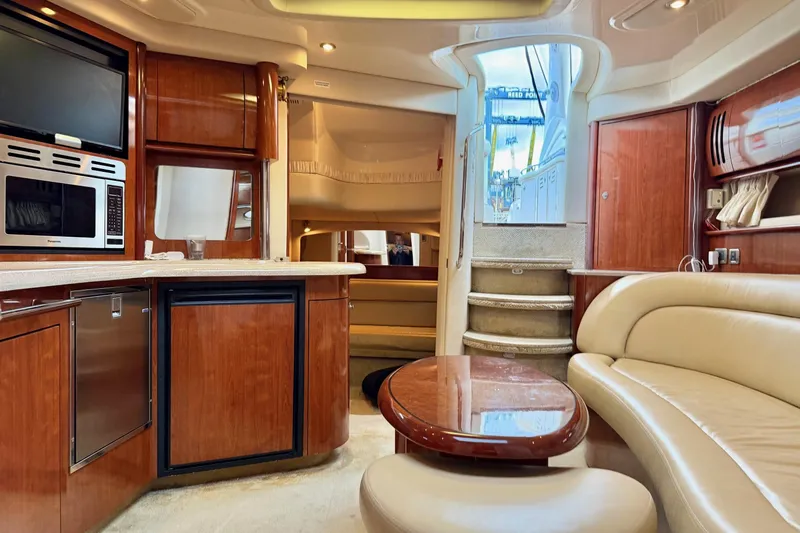  Yacht Photos Pics Luxurious interior of 2004 Sea Ray 420 Sundancer yacht with modern amenities and elegant design.