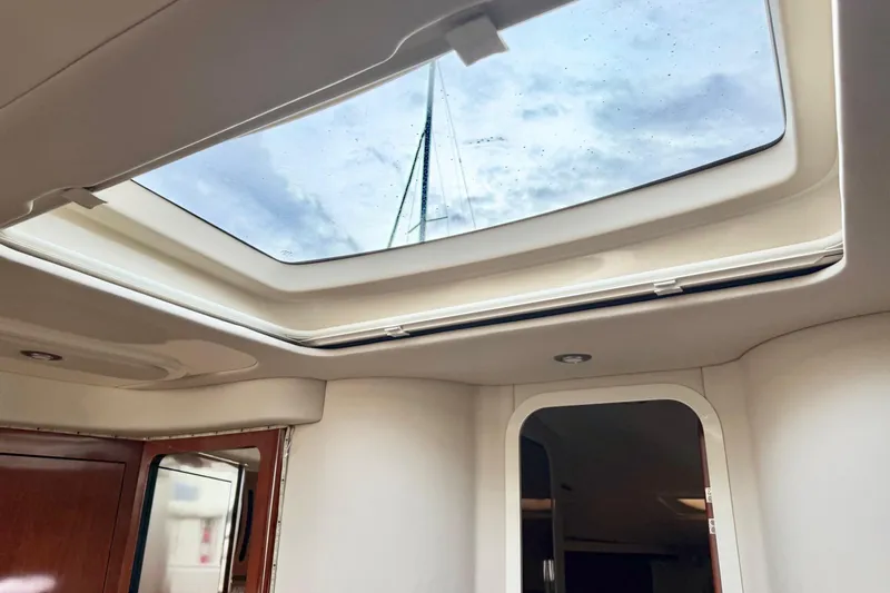  Yacht Photos Pics Interior view of 2004 Sea Ray 420 Sundancer with skylight and wooden accents.