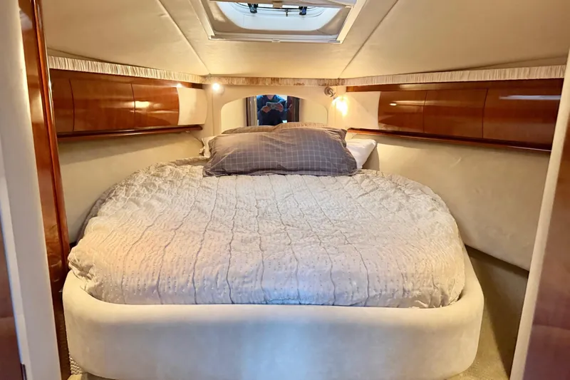  Yacht Photos Pics Luxurious cabin interior of 2004 Sea Ray 420 Sundancer yacht with cozy bed.