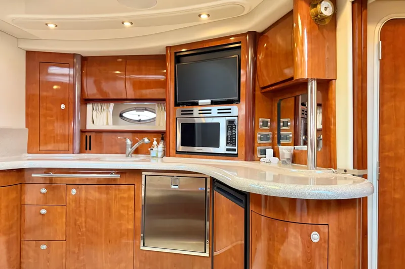  Yacht Photos Pics Luxurious 2004 Sea Ray 420 Sundancer yacht interior with modern kitchen amenities.