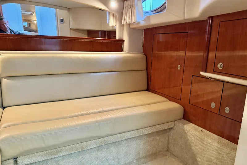  Yacht Photos Pics Interior of 2004 Sea Ray 420 Sundancer with beige seating and wooden cabinetry.