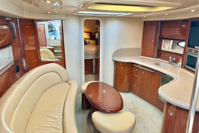  Yacht Photos Pics Luxurious interior of a 2004 Sea Ray 420 Sundancer yacht with elegant wood finishes.