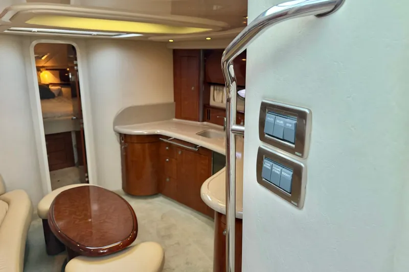  Yacht Photos Pics Interior of 2004 Sea Ray 420 Sundancer yacht with modern kitchen and seating area.
