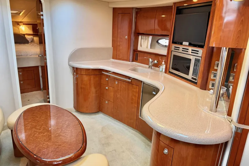 Yacht Photos Pics Luxurious 2004 Sea Ray 420 Sundancer yacht interior with modern kitchen and cozy seating area.