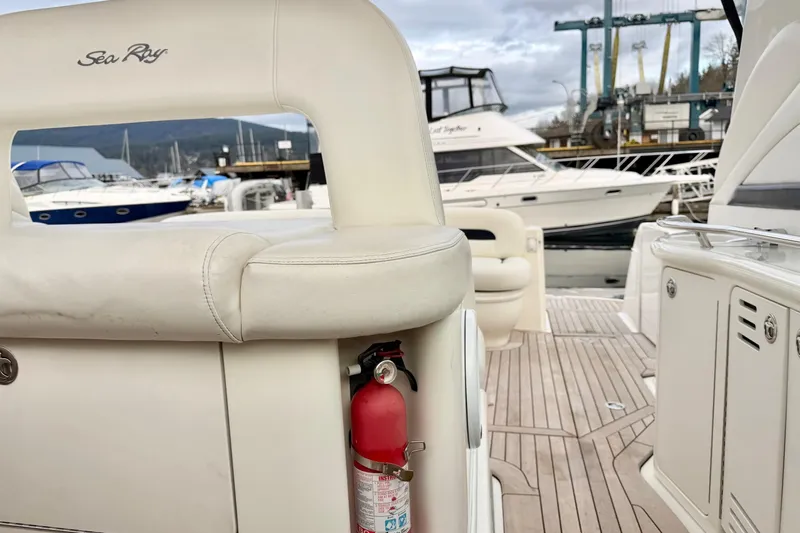  Yacht Photos Pics 2004 Sea Ray 420 Sundancer yacht interior with fire extinguisher, docked at marina.