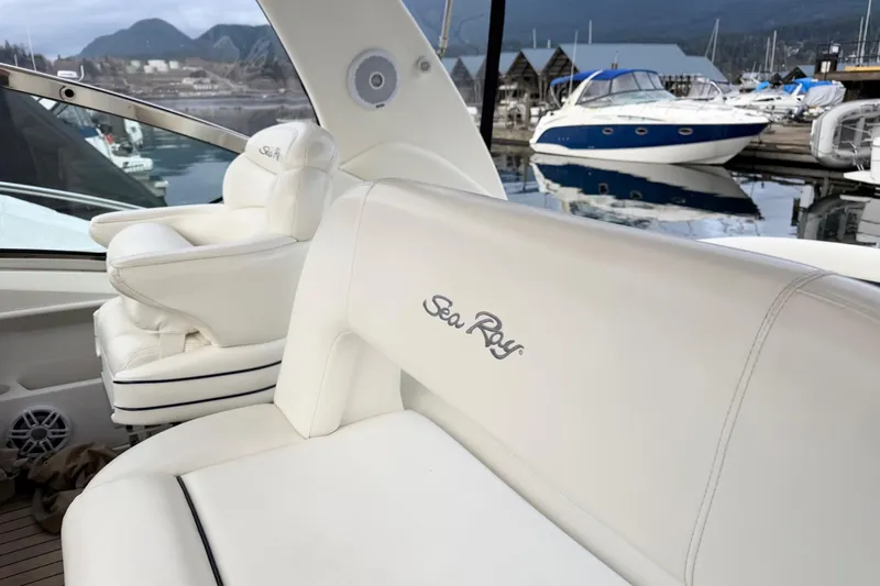  Yacht Photos Pics 2004 Sea Ray 420 Sundancer yacht interior with white seating at marina.