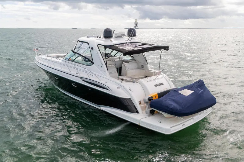  Yacht Photos Pics 2005 Formula 48 Yacht cruising on open water under cloudy skies.