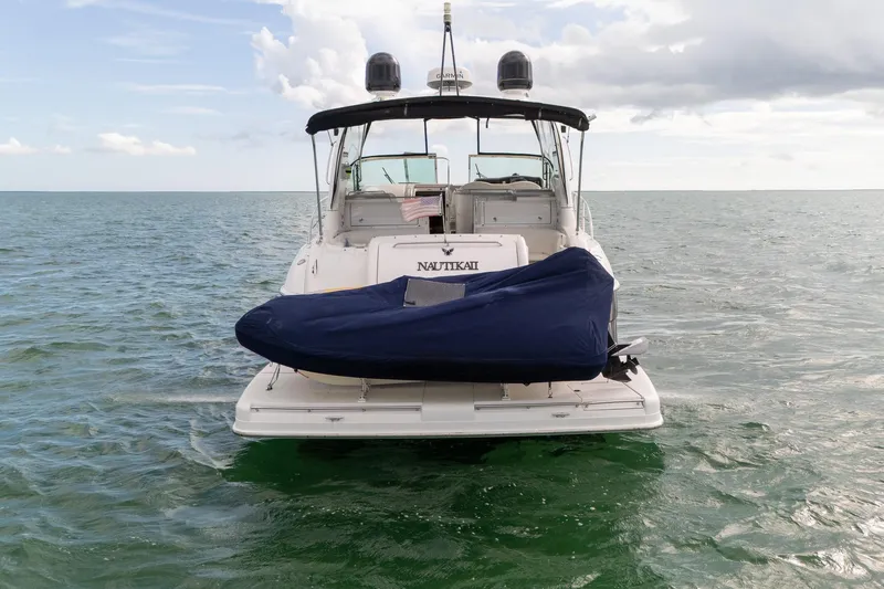  Yacht Photos Pics 2005 Formula 48 Yacht on water, rear view with covered equipment.