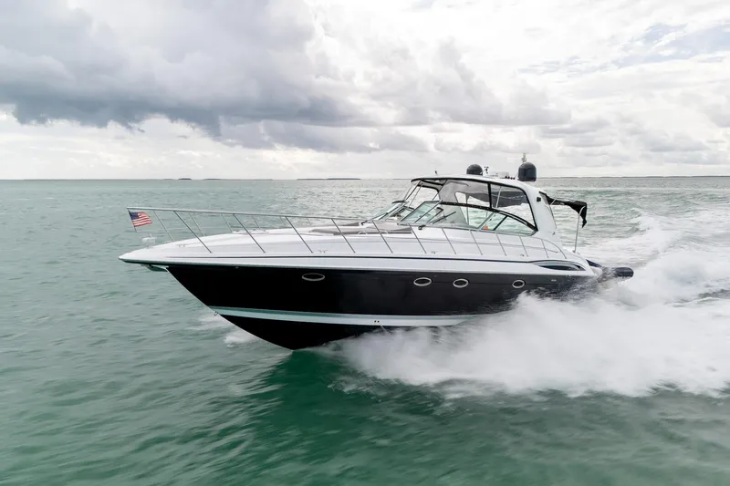  Yacht Photos Pics 2005 Formula 48 Yacht cruising on open water under cloudy skies.