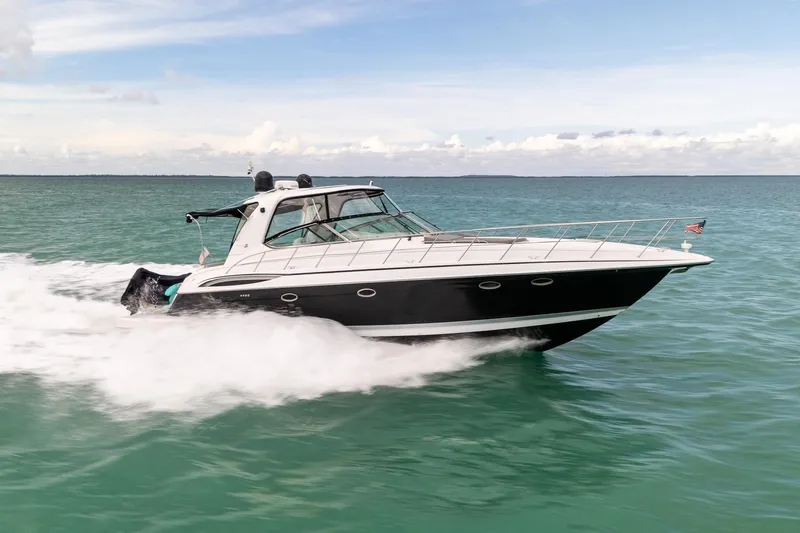  Yacht Photos Pics 2005 Formula 48 Yacht cruising on open water under a clear sky.