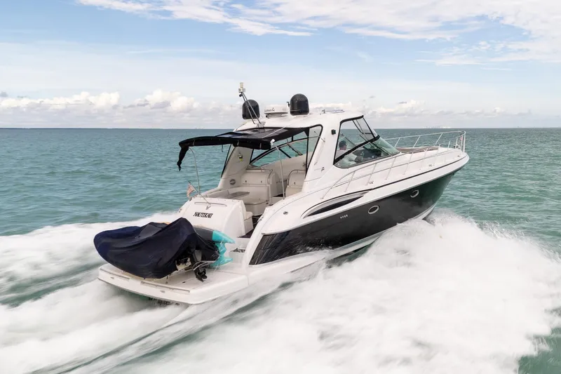  Yacht Photos Pics 2005 Formula 48 Yacht cruising on open water under a clear sky.