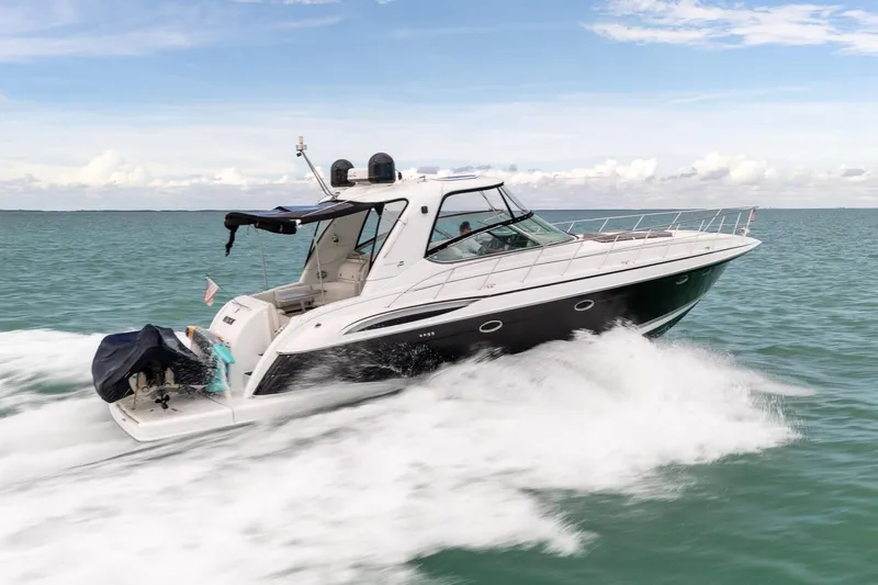  Yacht Photos Pics 2005 Formula 48 Yacht cruising on open water under a clear sky.