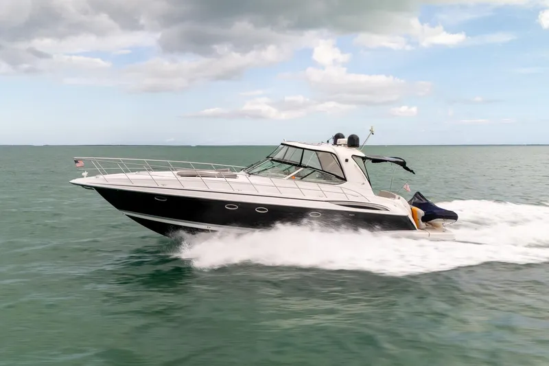  Yacht Photos Pics 2005 Formula 48 Yacht cruising on open water under cloudy skies.