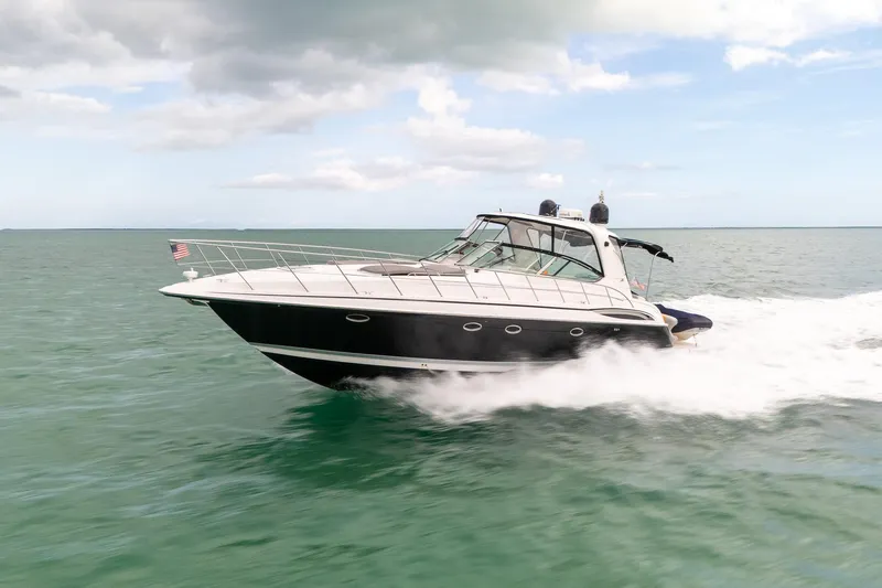  Yacht Photos Pics 2005 Formula 48 Yacht cruising on open water under a partly cloudy sky.