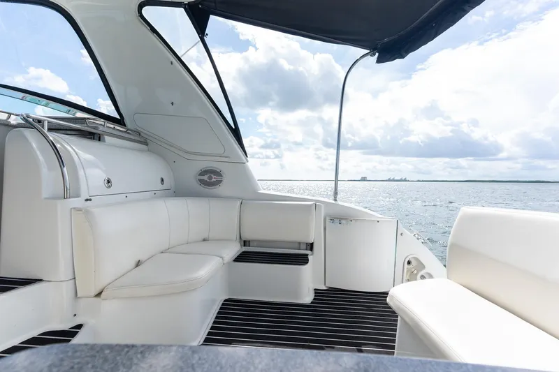  Yacht Photos Pics 2005 Formula 48 Yacht interior with white seating, overlooking serene ocean view.