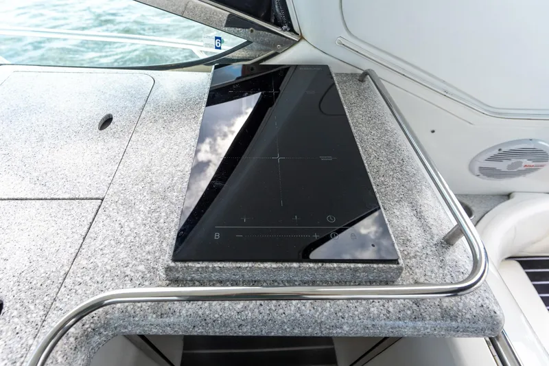  Yacht Photos Pics Granite countertop with sleek black cooktop on 2005 Formula 48 Yacht.