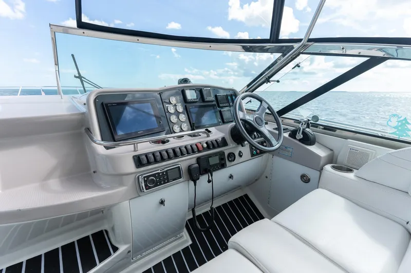  Yacht Photos Pics Helm of 2005 Formula 48 Yacht with modern navigation equipment and ocean view.