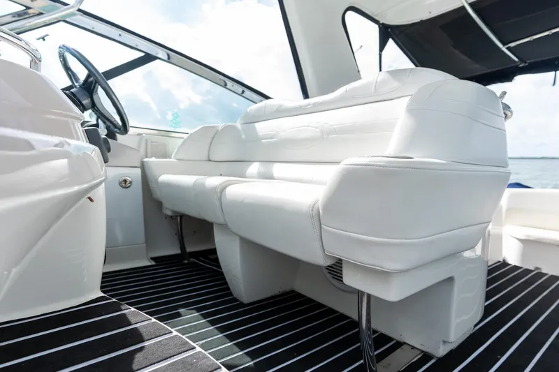  Yacht Photos Pics 2005 Formula 48 Yacht interior with white seating and striped flooring.