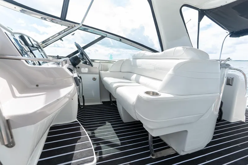  Yacht Photos Pics Interior of 2005 Formula 48 Yacht with white seating and modern dashboard.