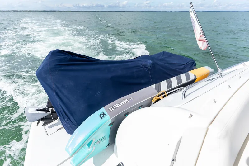  Yacht Photos Pics 2005 Formula 48 Yacht cruising with paddleboard on deck, ocean view.