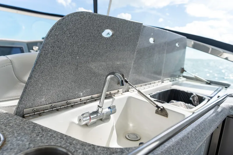  Yacht Photos Pics Luxury 2005 Formula 48 Yacht sink area with granite countertop and ocean view.
