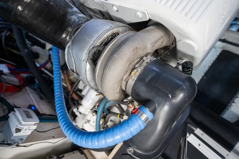  Yacht Photos Pics Engine component of a 2005 Formula 48 Yacht, featuring hoses and mechanical parts.