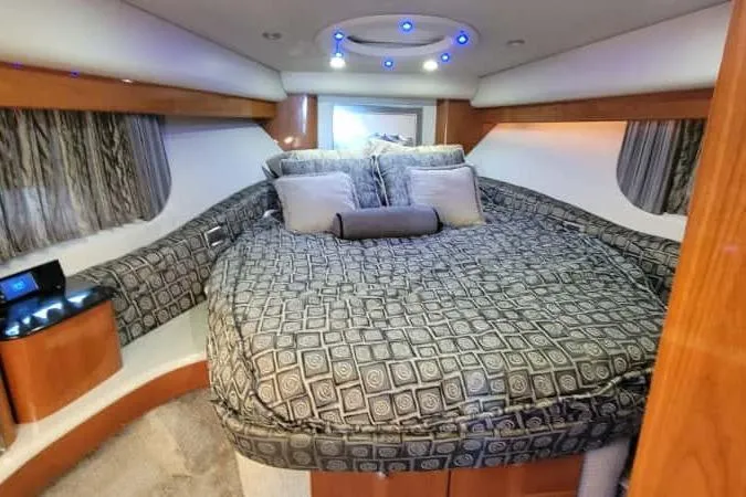  Yacht Photos Pics Luxurious interior of a 2005 Formula 48 Yacht with elegant bedding and ambient lighting.