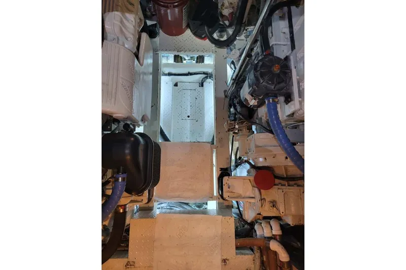  Yacht Photos Pics Engine room of a 2005 Formula 48 Yacht, showcasing mechanical components and piping.