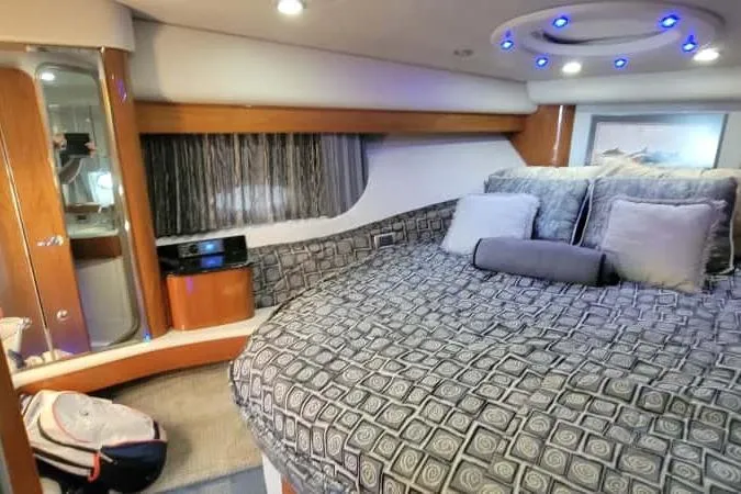  Yacht Photos Pics Luxurious interior of a 2005 Formula 48 Yacht with plush bedding and modern lighting.
