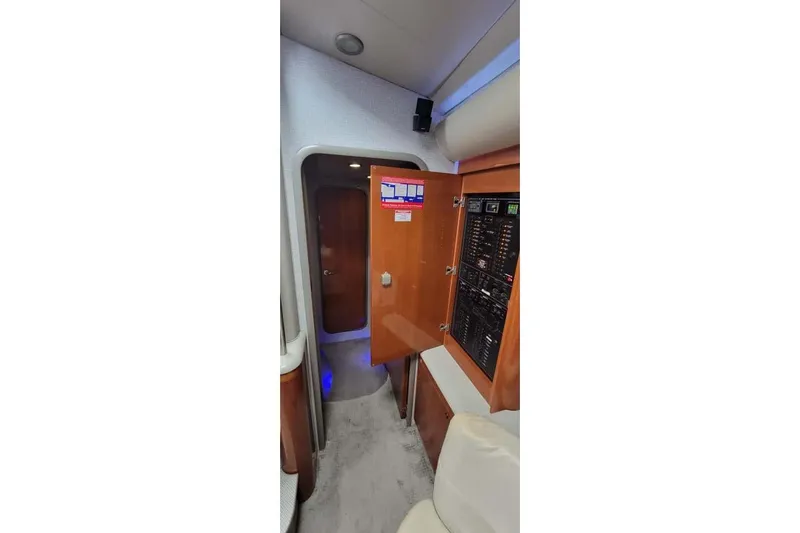  Yacht Photos Pics Interior of 2005 Formula 48 Yacht with control panel and wooden cabinetry.