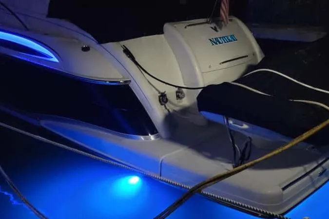  Yacht Photos Pics 2005 Formula 48 Yacht with blue underwater lights at night.