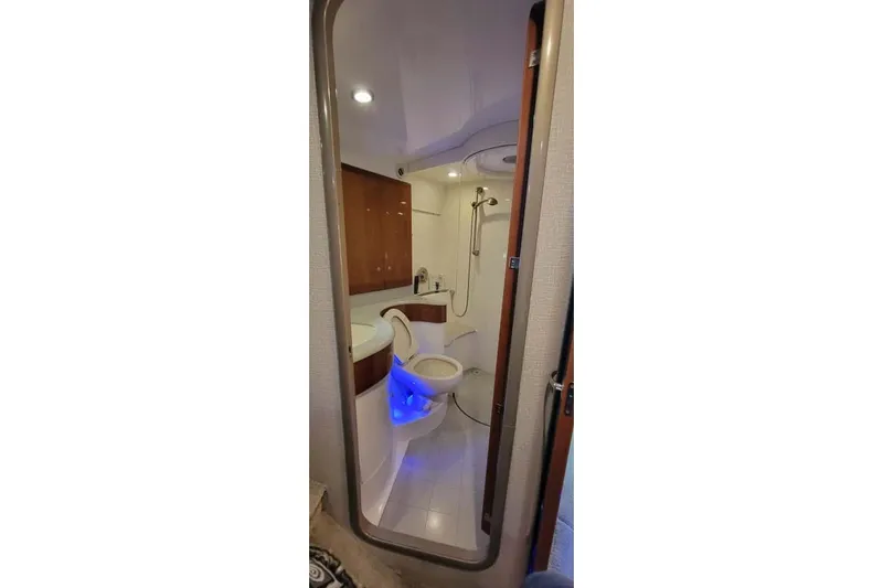  Yacht Photos Pics Luxurious bathroom in 2005 Formula 48 Yacht with modern fixtures and ambient lighting.