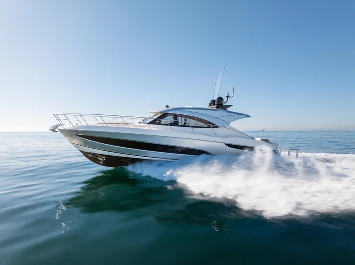 Ventures64 Yacht Photos Pics 2022 Riviera 4800 Sport Yacht cruising on open water.