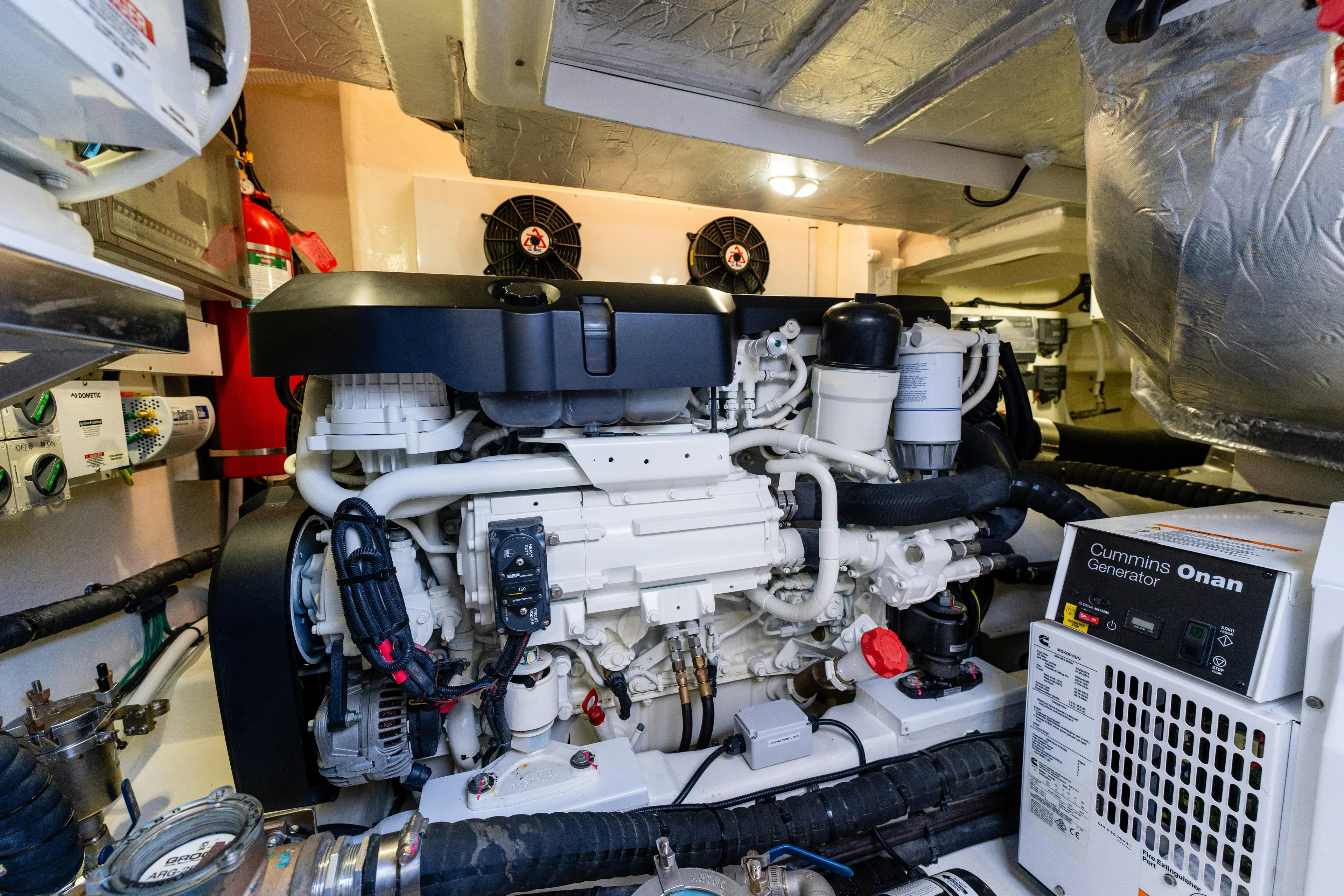 Ventures64 Yacht Photos Pics Engine room of 2022 Riviera 4800 Sport Yacht with Cummins Onan generator.