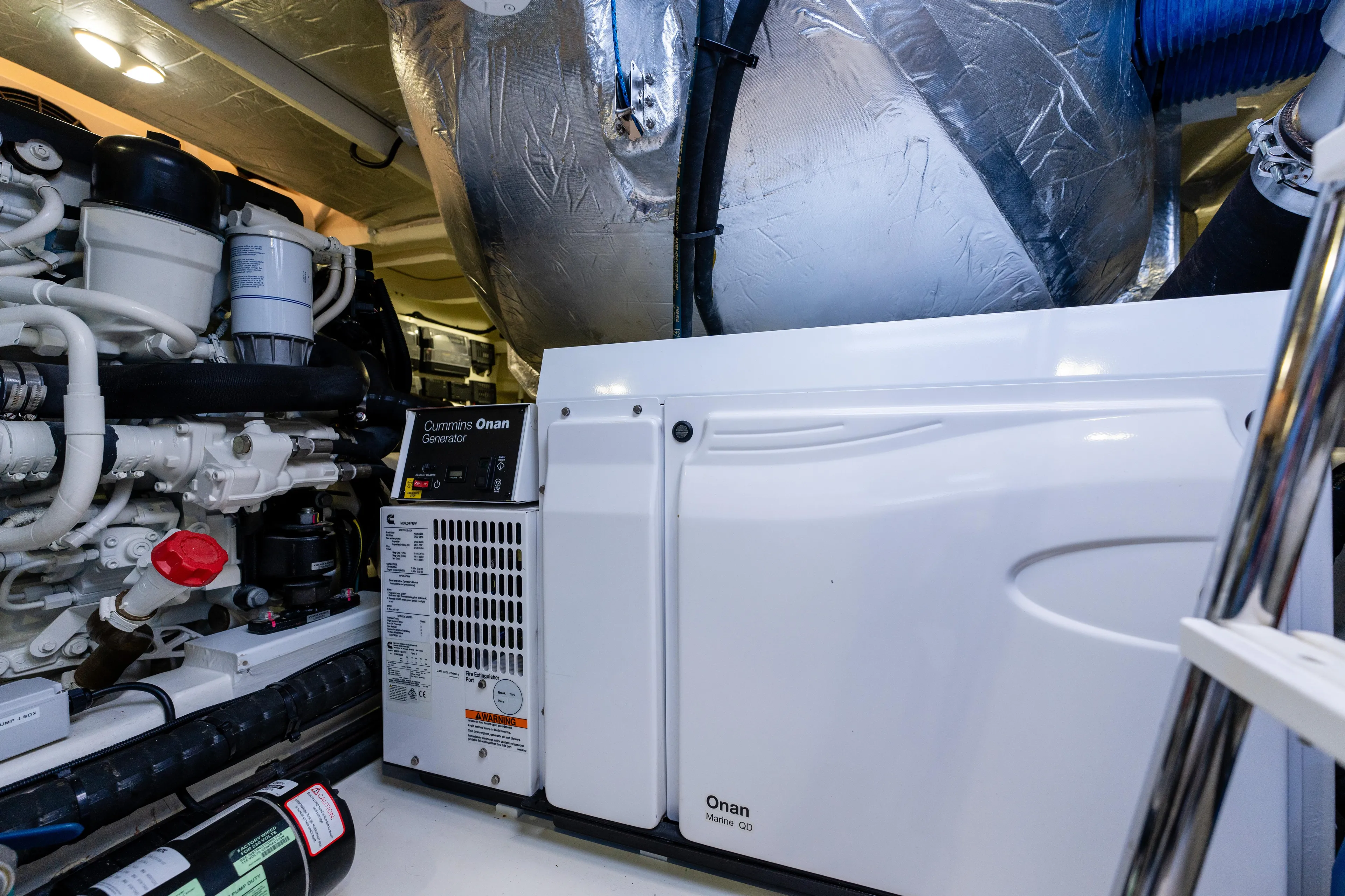 Ventures64 Yacht Photos Pics Engine room of 2022 Riviera 4800 Sport Yacht with Onan generator.