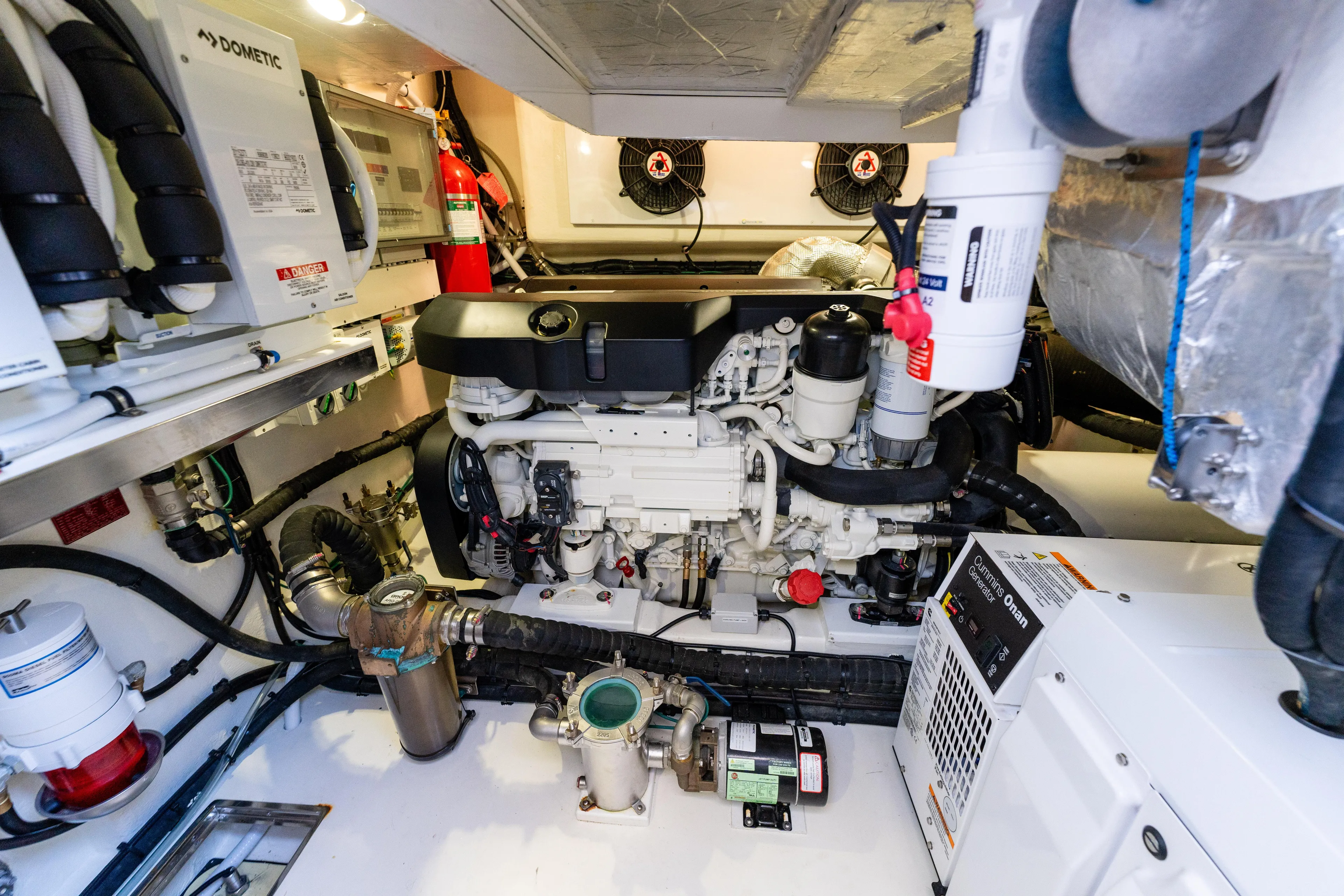 Ventures64 Yacht Photos Pics Engine room of 2022 Riviera 4800 Sport Yacht, showcasing advanced machinery and equipment.