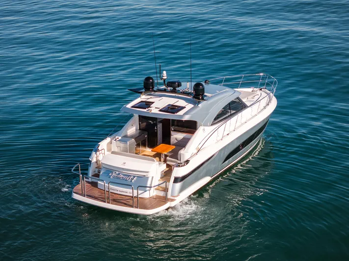 Ventures64 Yacht Photos Pics 2022 Riviera 4800 Sport Yacht cruising on open water.