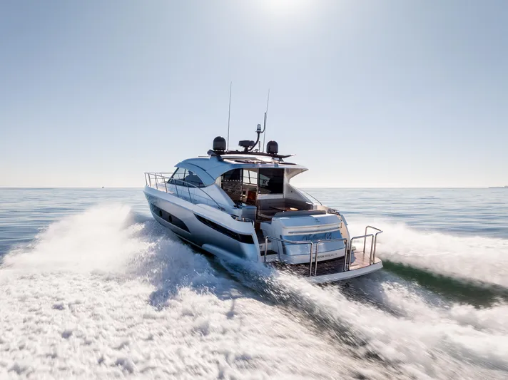 Ventures64 Yacht Photos Pics 2022 Riviera 4800 Sport Yacht cruising on open water.