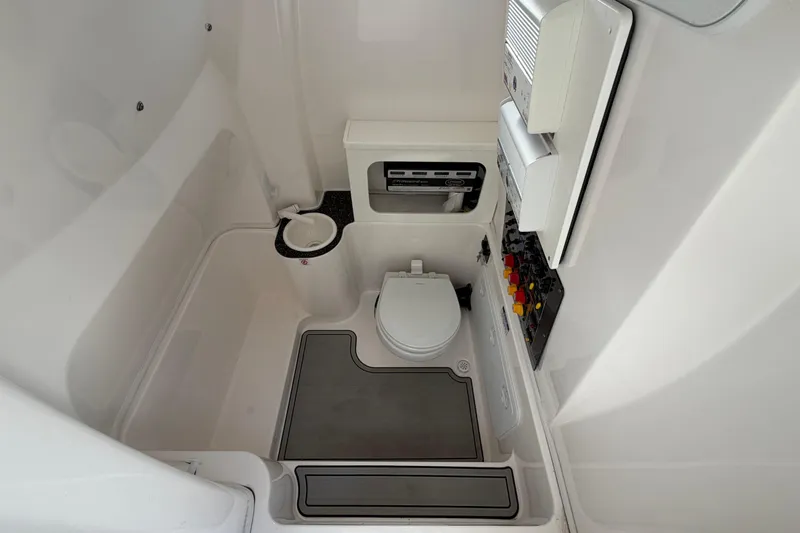  Yacht Photos Pics Interior of 2022 Sea Fox 288 Commander boat bathroom with toilet and control panel.