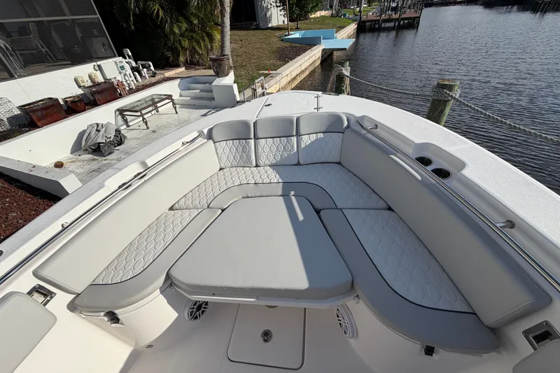  Yacht Photos Pics Luxurious seating area on 2022 Sea Fox 288 Commander boat by the water.